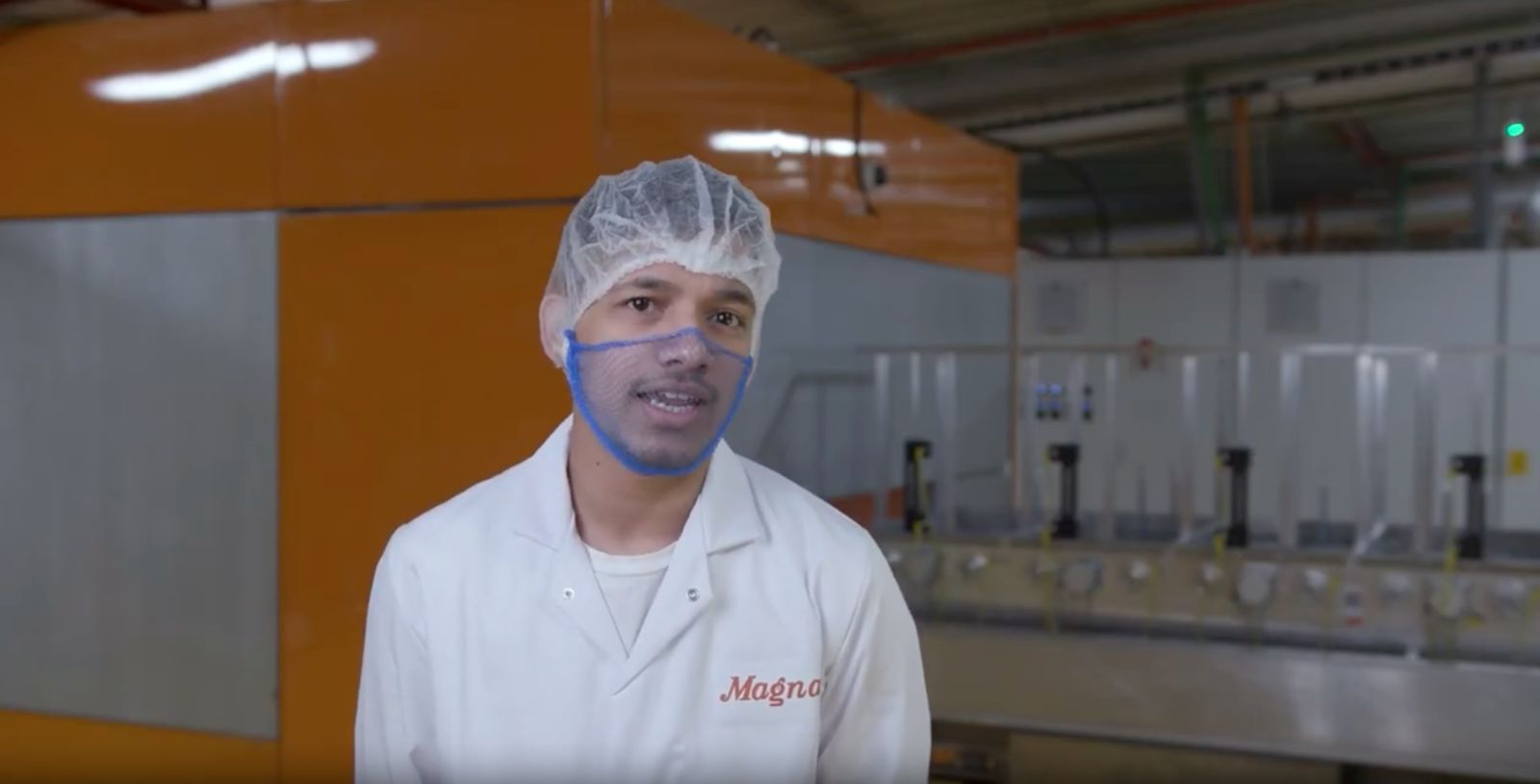 A Magna team member speaking to camera