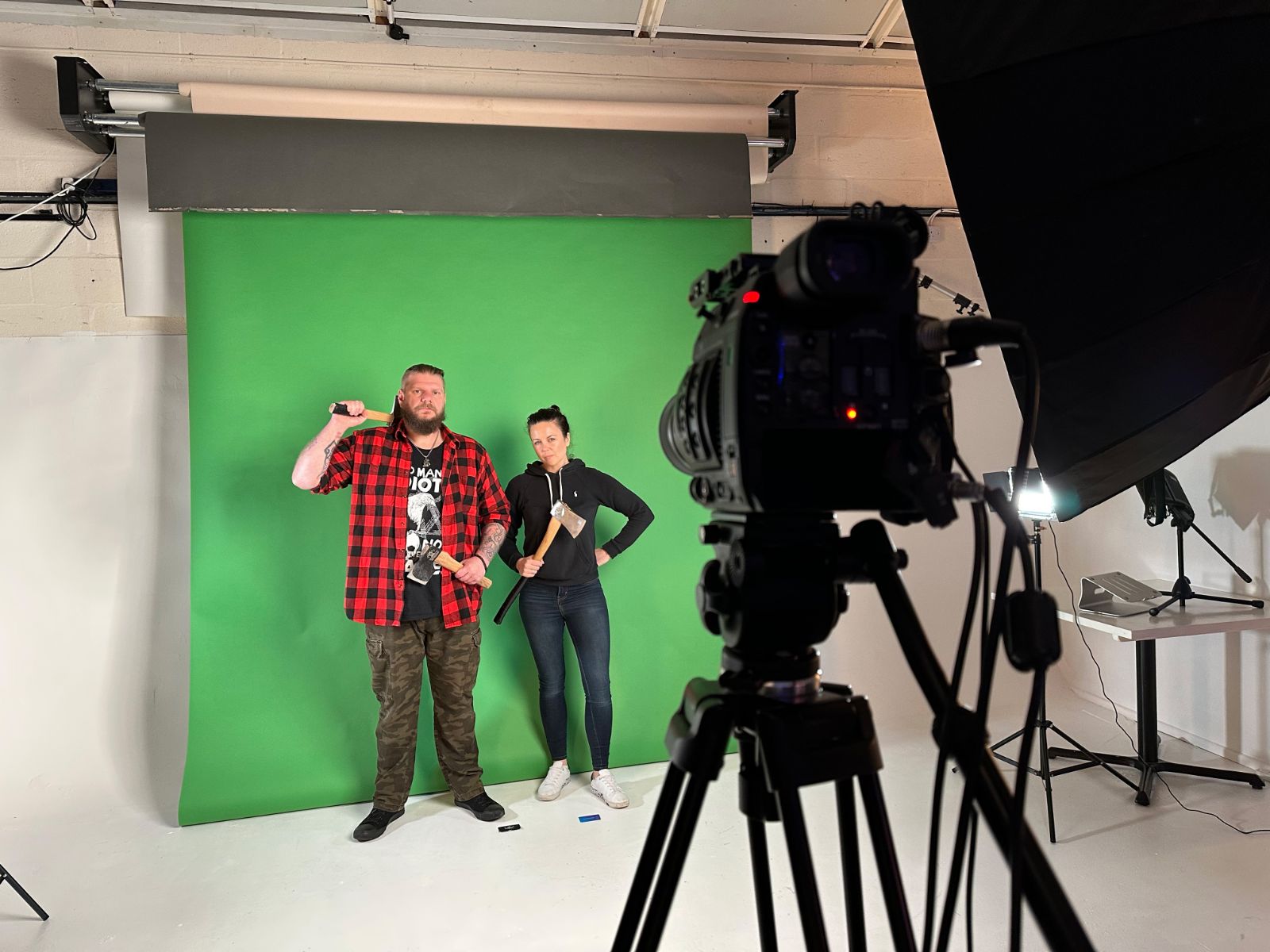 Our team filming two presenters against a green screen