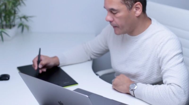One of our designers sketching on a drawing tablet