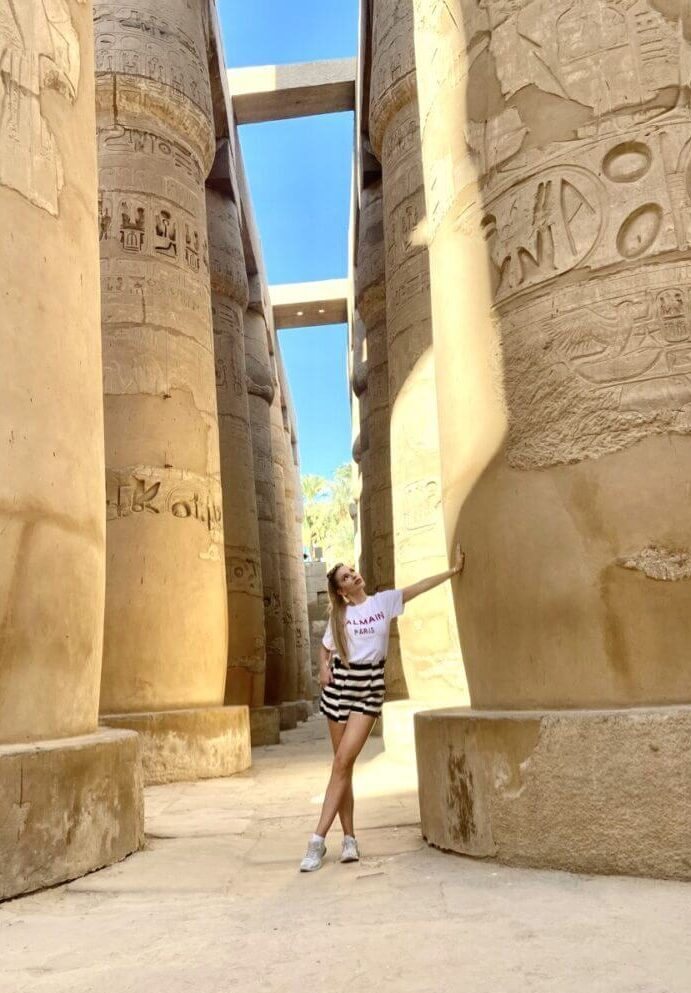Marie among ancient stone columns